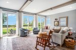 The Perfect Space for a Quiet Morning Read with Your Favorite Brew - The Main Level Living Room at Blueberry Bluff